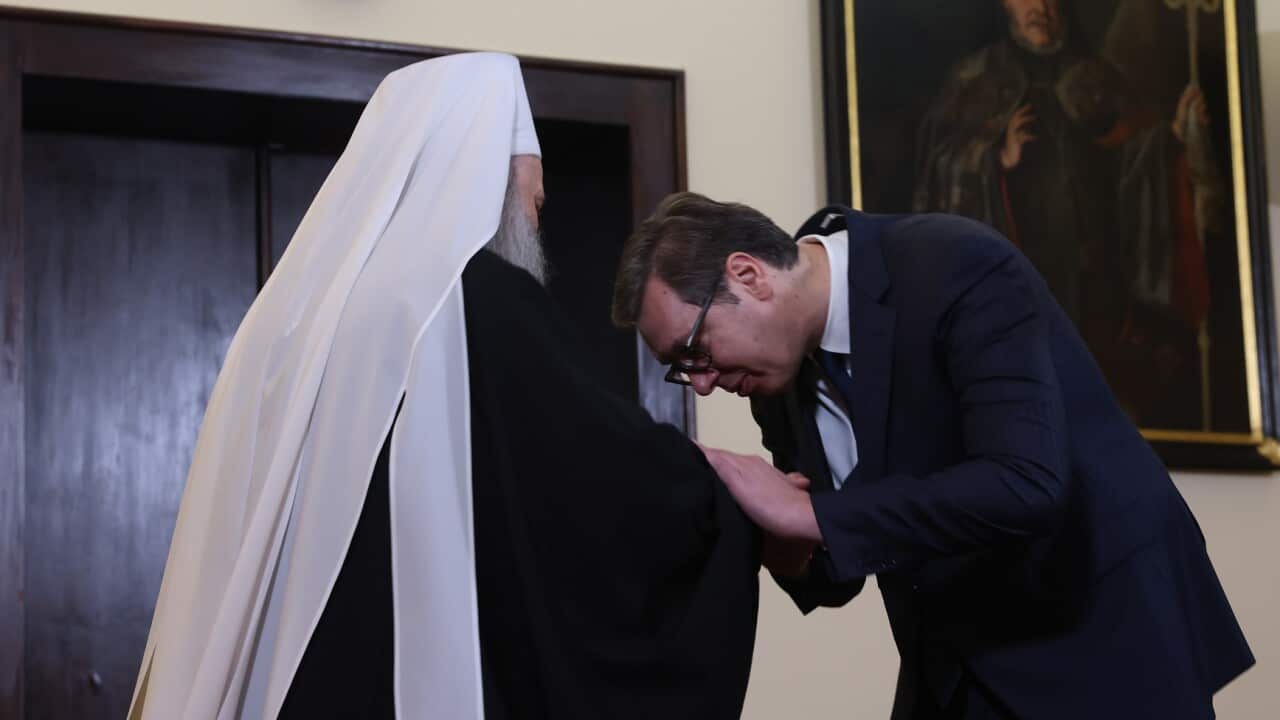 Serbian President Aleksandar Vucic kisses the hand of the Patriarch of the Serbian Orthodox Church Porfirije (AAP)