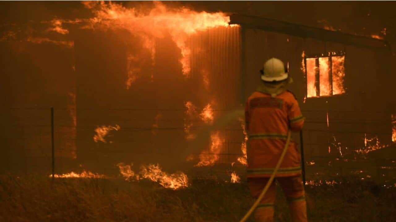 NSW Rural Fire Service crews fight the Gospers Mountain Fire as it impacts a property at Bilpin, Saturday, 21 December, 2019. 