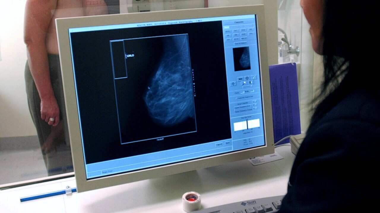 A radiographer performs a mammogram in Melbourne