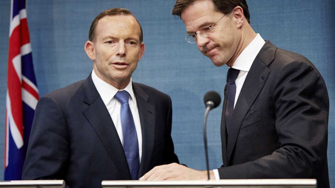 Tony Abbott (L) and his Dutch counterpart Mark Rutte (R).