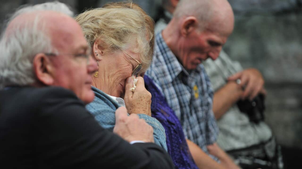David Hill, left, and other former child migrants hear an apology in 2010