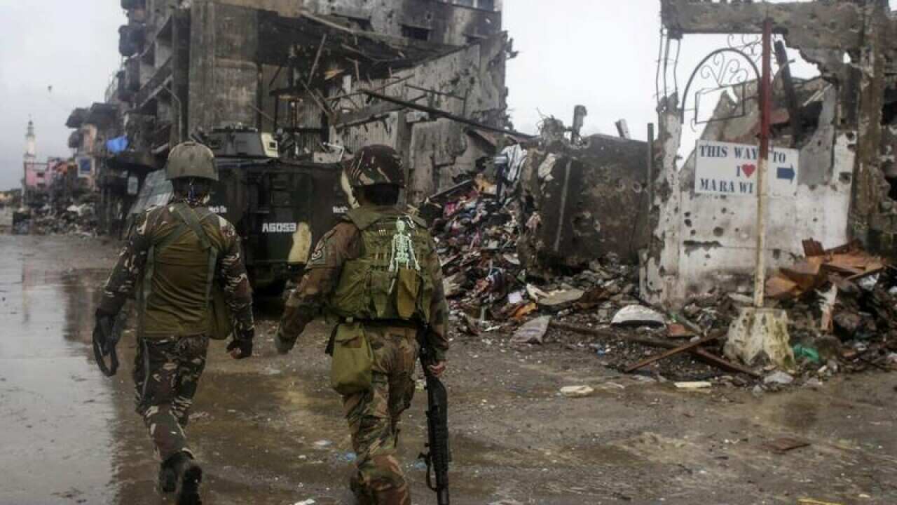 Filipino soldiers conduct a patrol