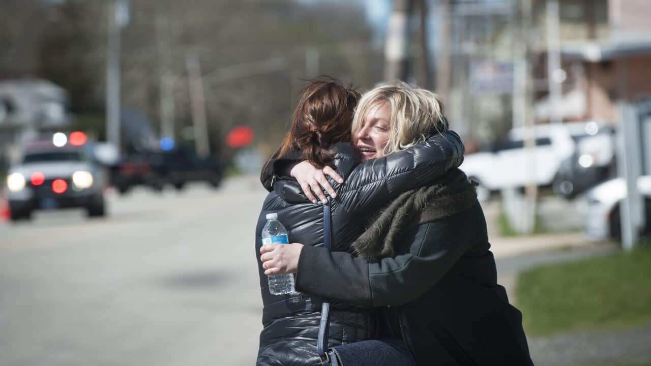 Passenger Valerie Green (R) hugs her friend after Amtrak's Palmetto Train 89 collided with a backhoe in Chester, Pennsylvania, USA, 03 April 2016.