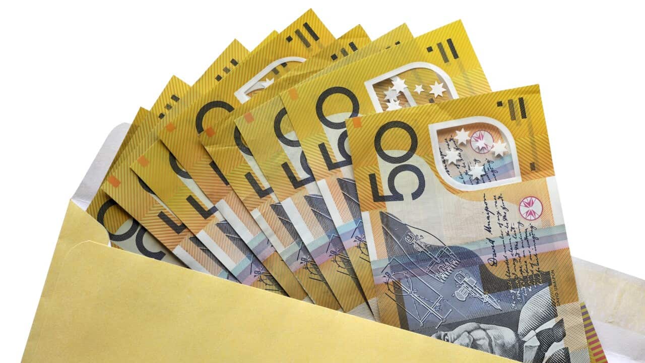 Open envelope of Australian fifty dollar notes