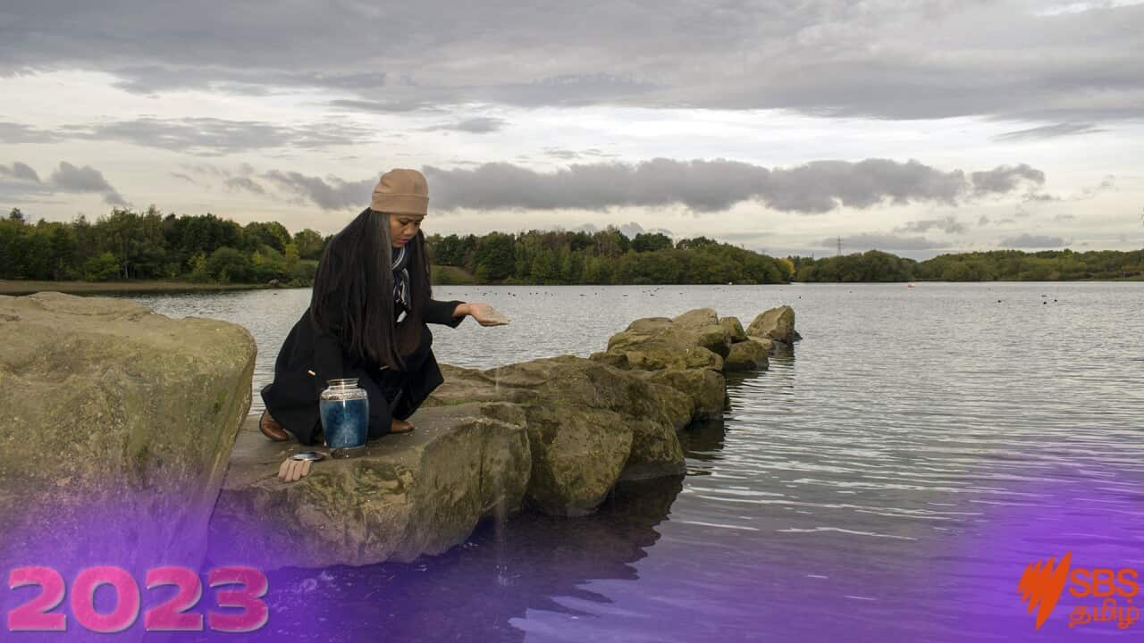 Sad Female Scattering The Cremated Ashes Of A Loved One From A Funeral Urn