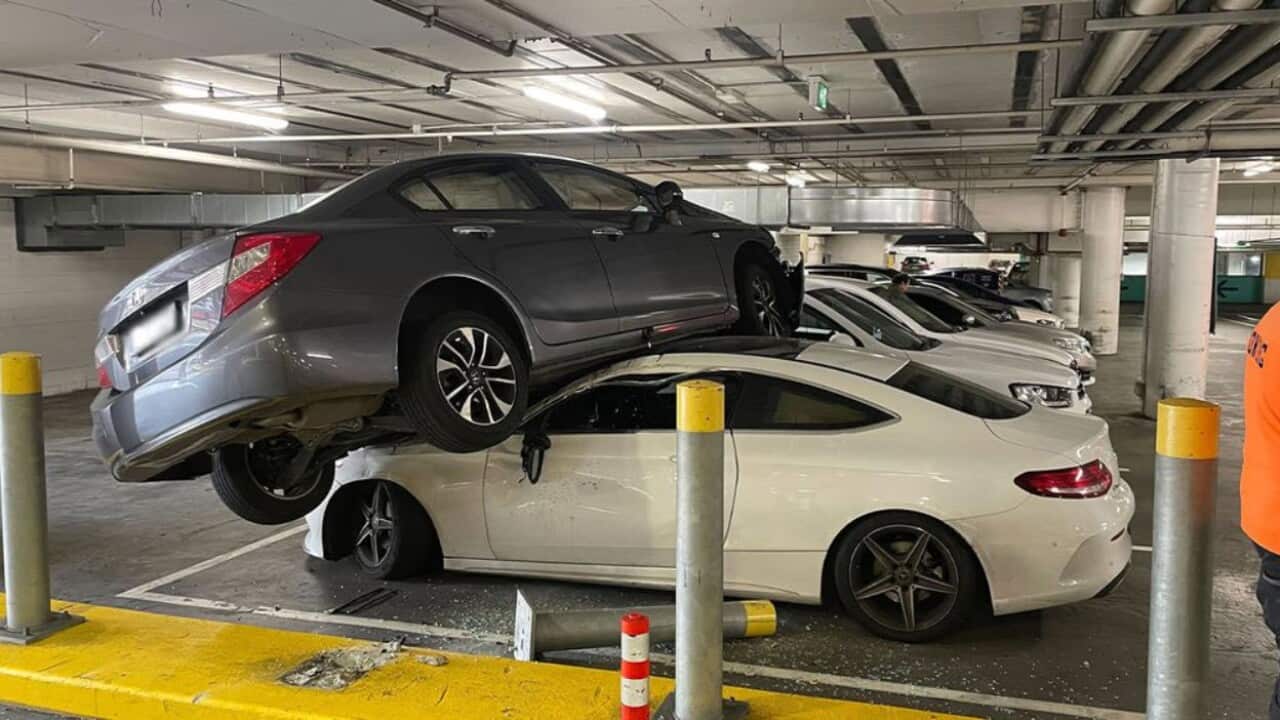 Mercedes squashed by another car in Sydney carpark crash