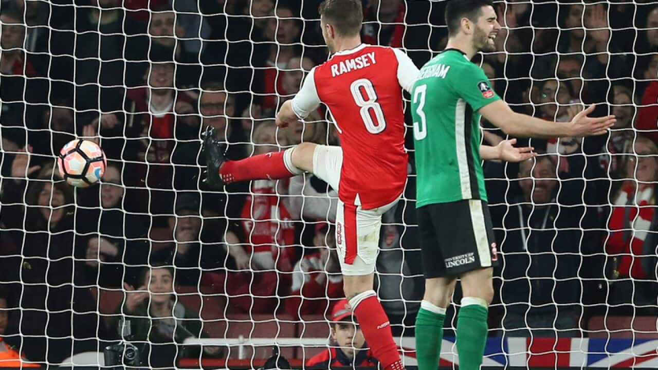 Arsenal's Aaron Ramsey scoring his sides fifth goal