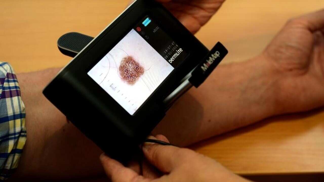 A patient being checked for skin cancers