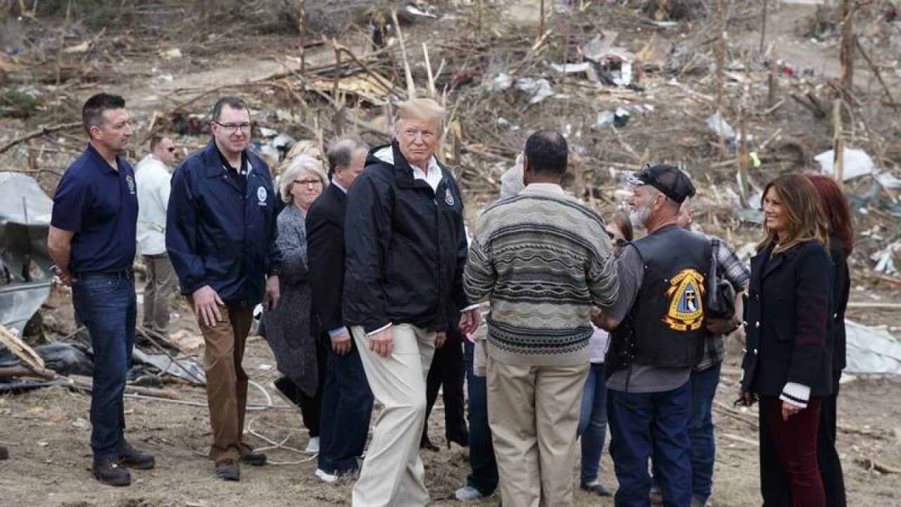 President Trump and the first lady chat to locals