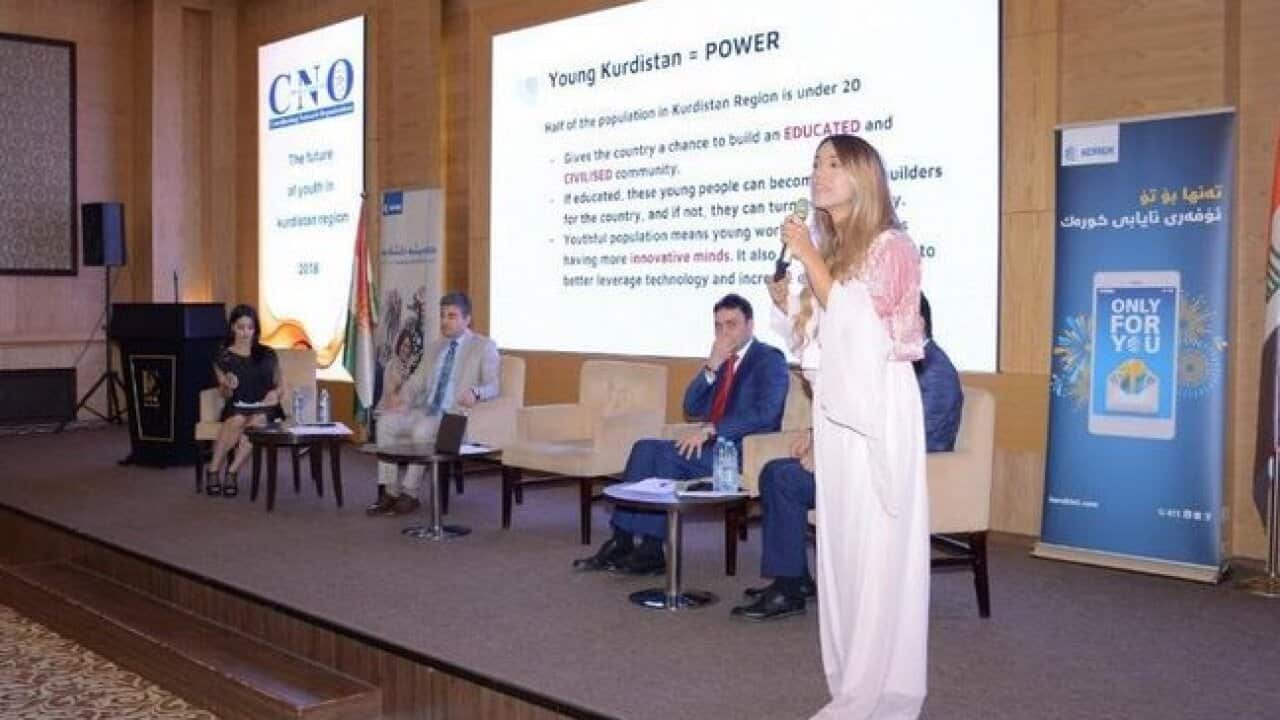 Dashni Morad speaking at women's rights event