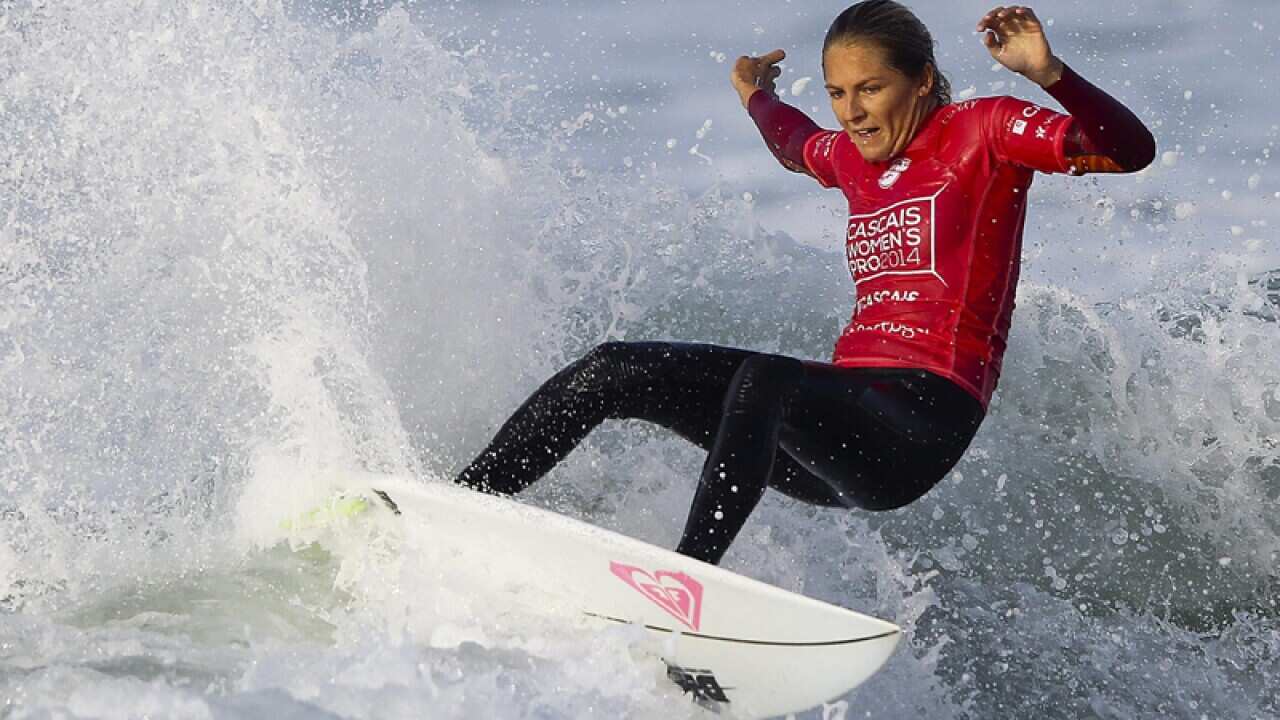 Stephanie Gilmore surfs.