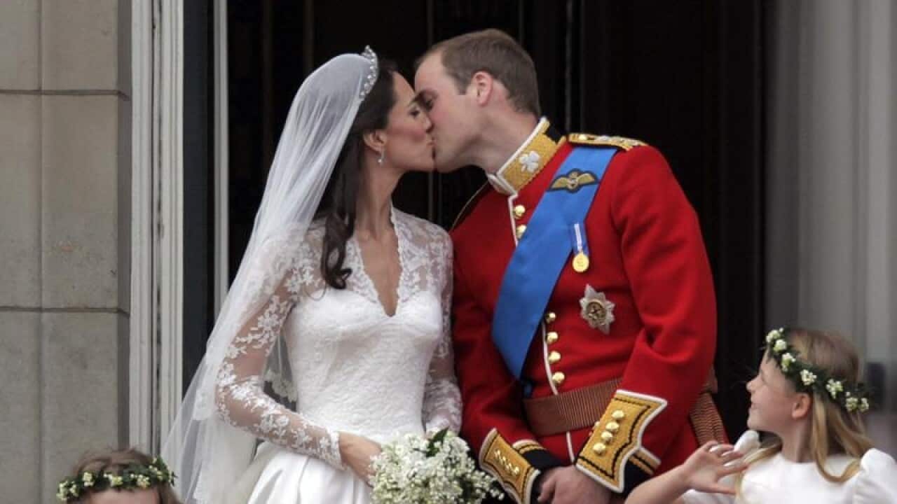Prince William kisses his wife Kate, Duchess of Cambridge.