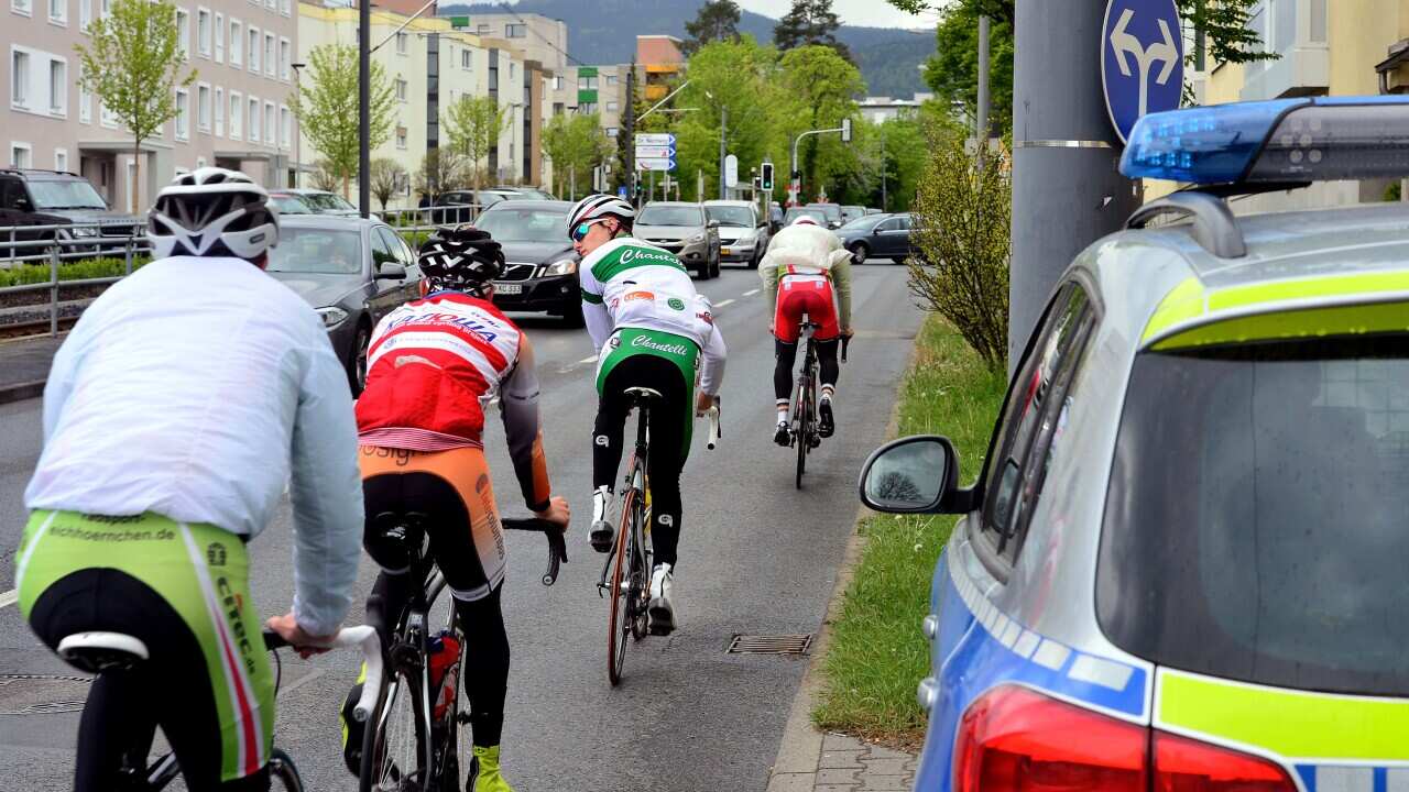  Cyclists ride past the apartment in which a couple was arrested late on Wednesday evening on suspicions of plotting a terror attack on April 30, 2015 in Oberursel, Germany. 