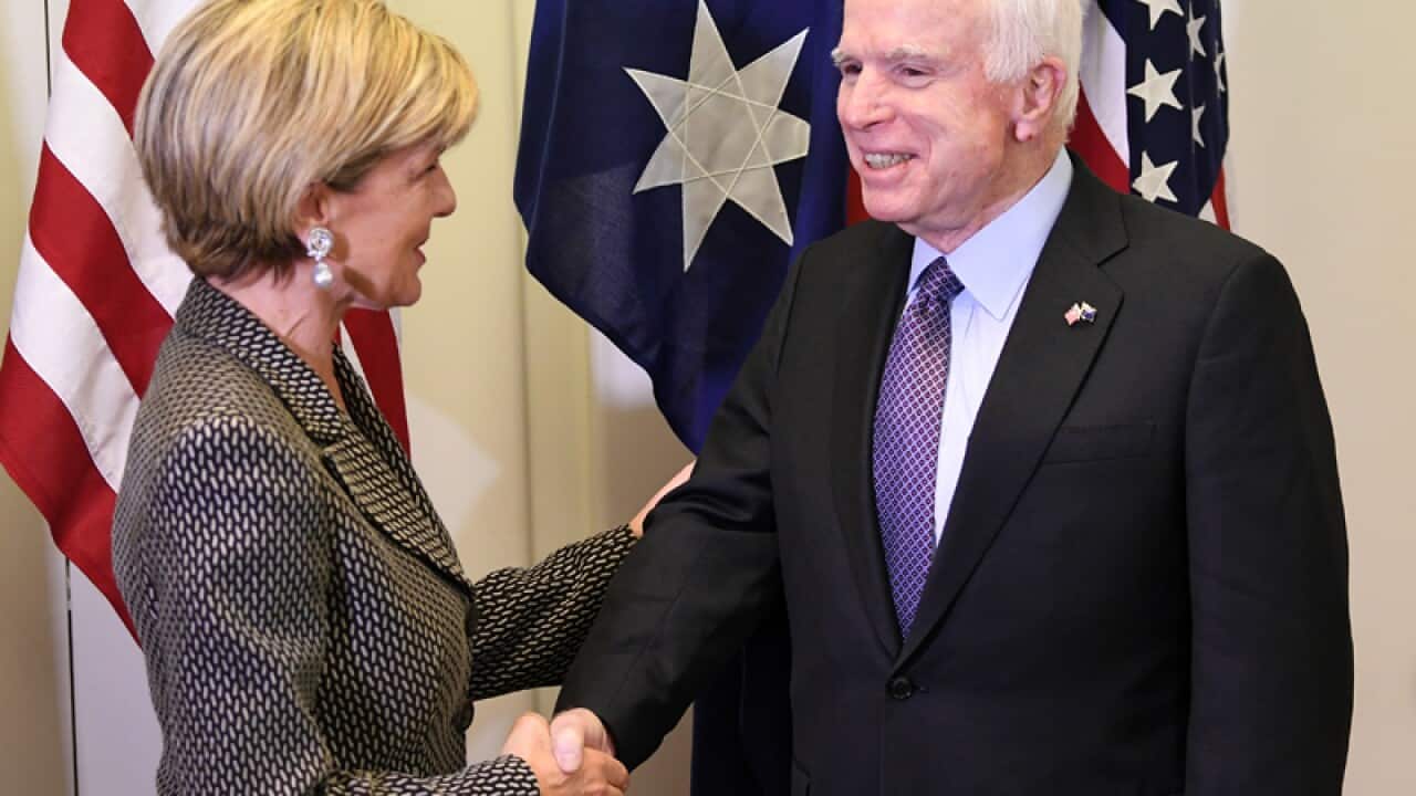 John McCain shakes hands with Minister Julie Bishop
