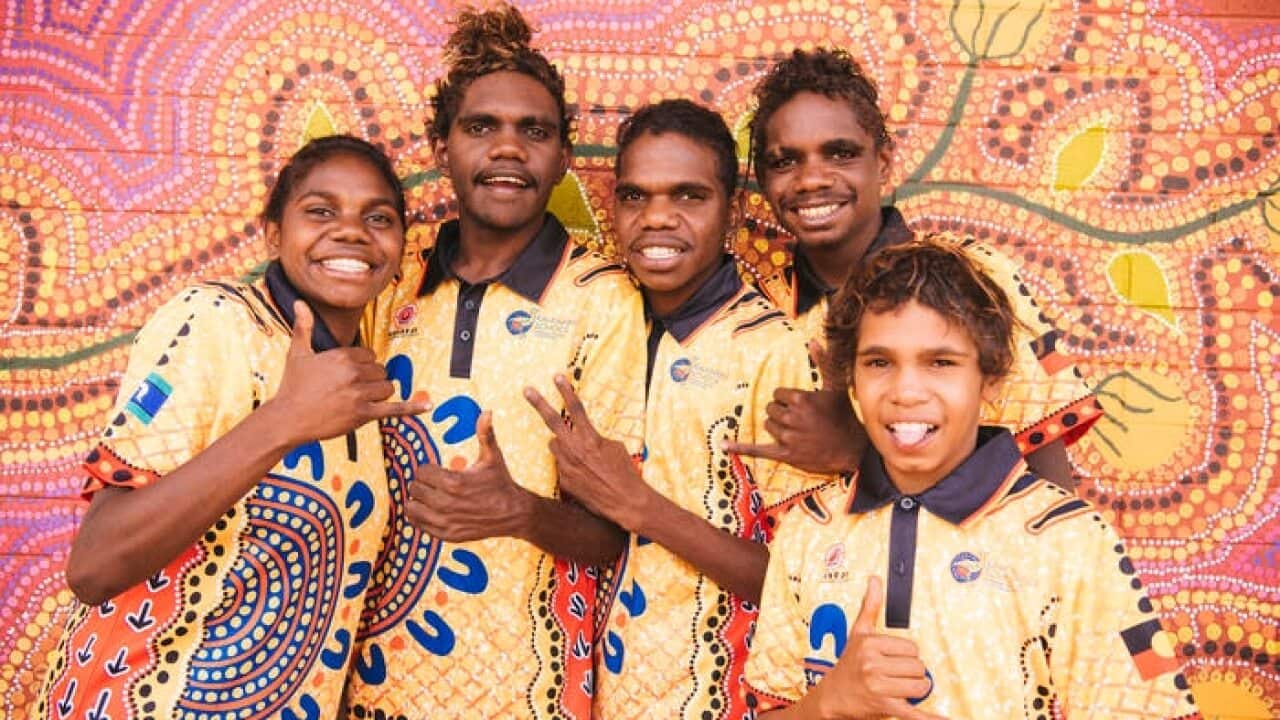 Kids at Aboriginal school giving the thumbs up