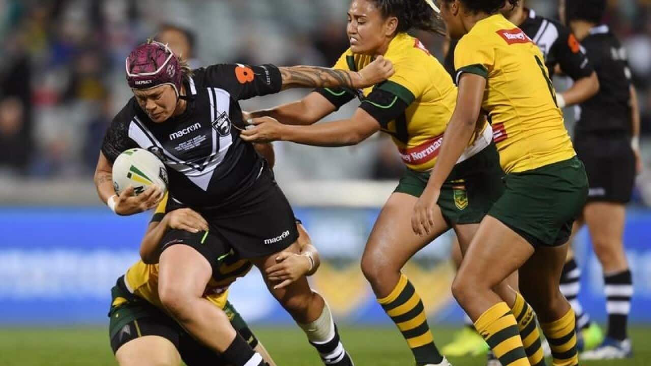The Kiwi Ferns' Laura Mariu is tackled by the Jillaroos