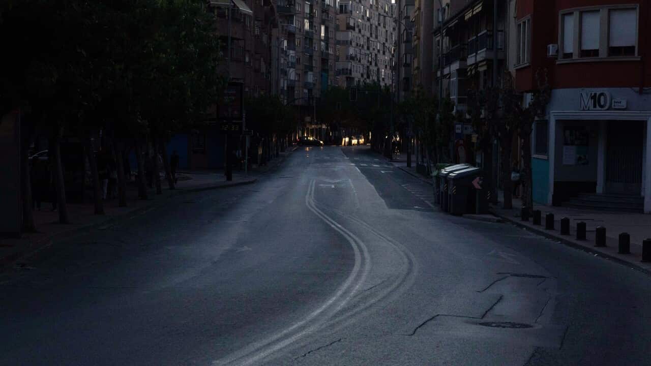 A darkened street is seen empty during the power outage, in Murcia, Spain (AAP)