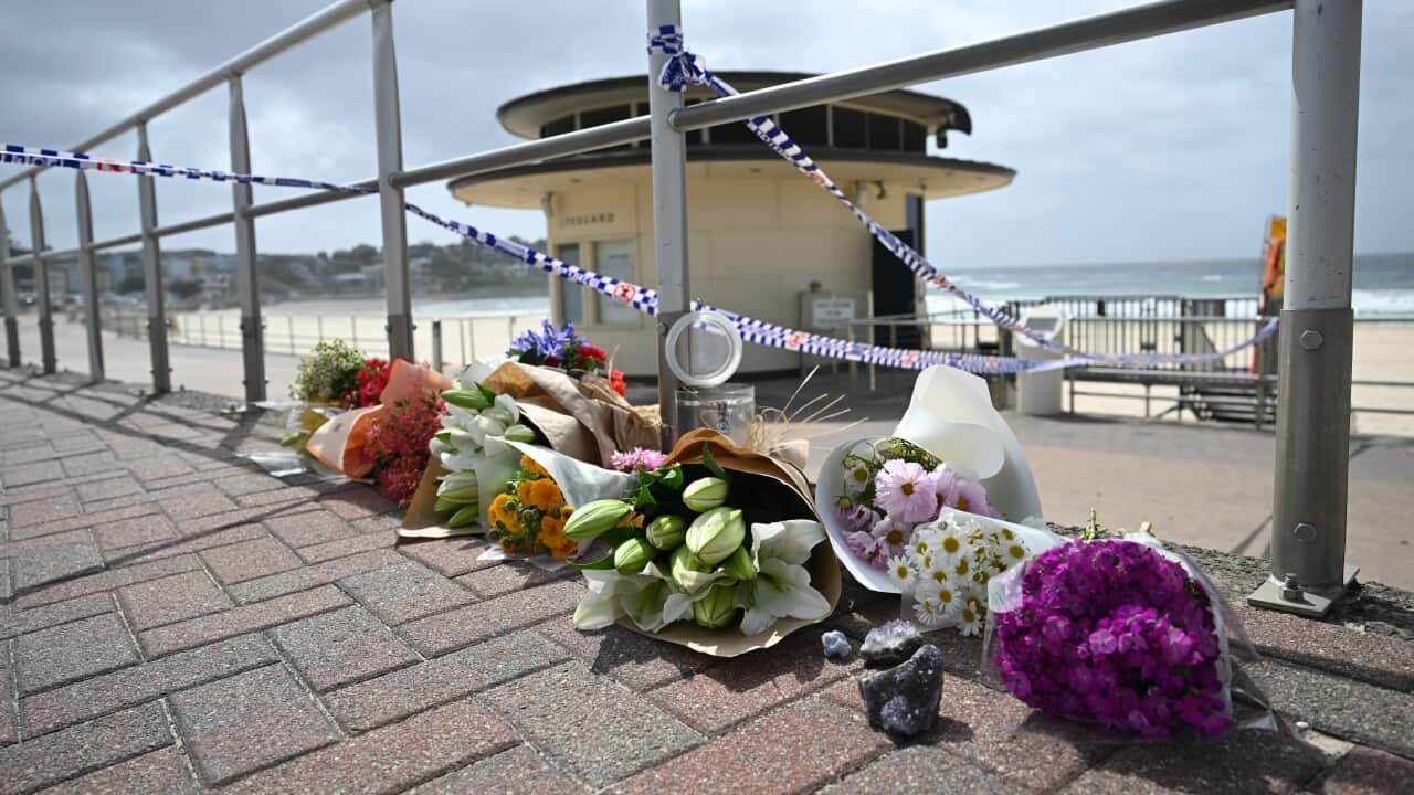 Flowers at the site where two gunmen opened fire at Bondi Beach in Sydney, Monday, December 15, 2025.