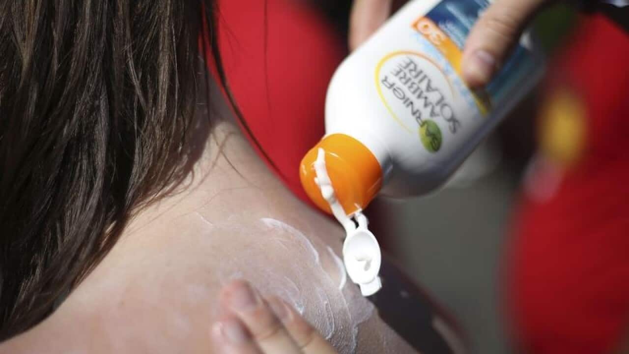 Slathering on sunscreen