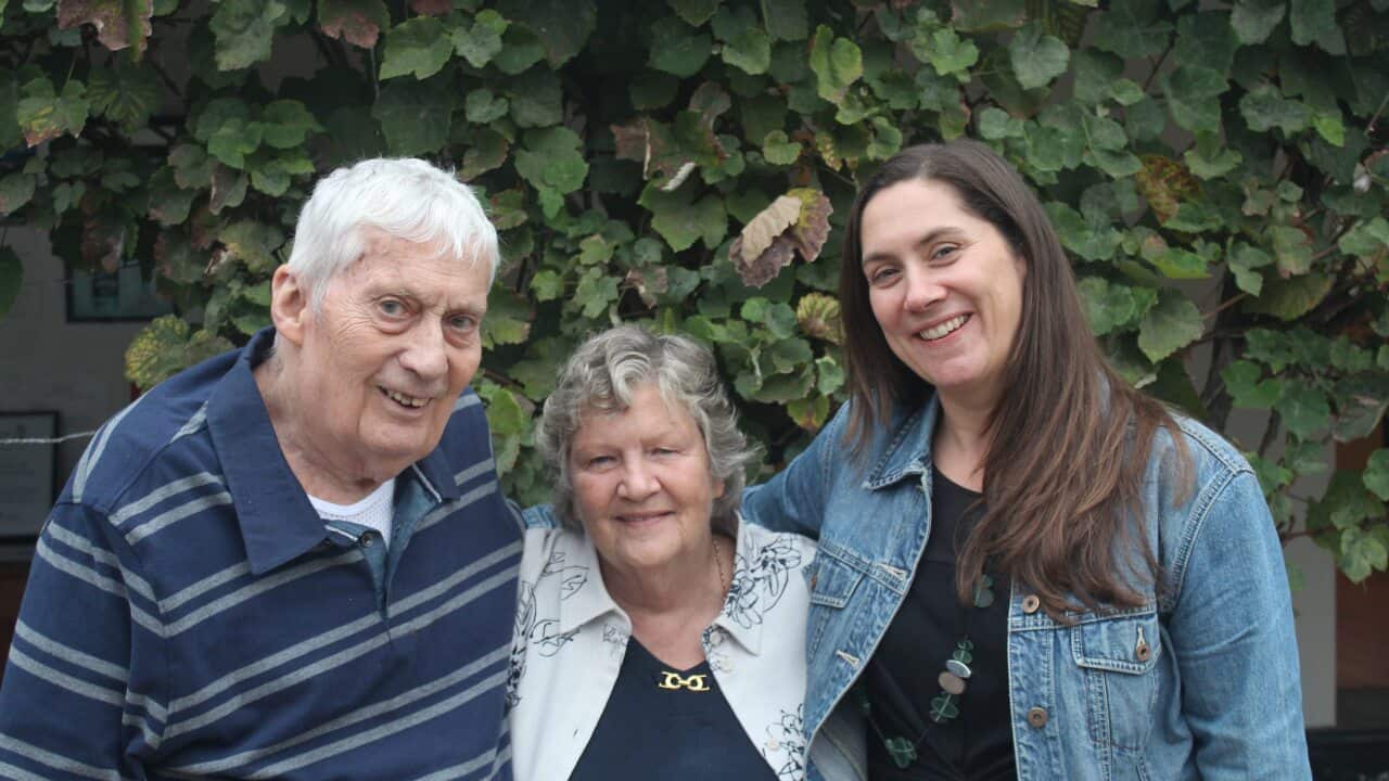 Melinda Holmes with her parents.