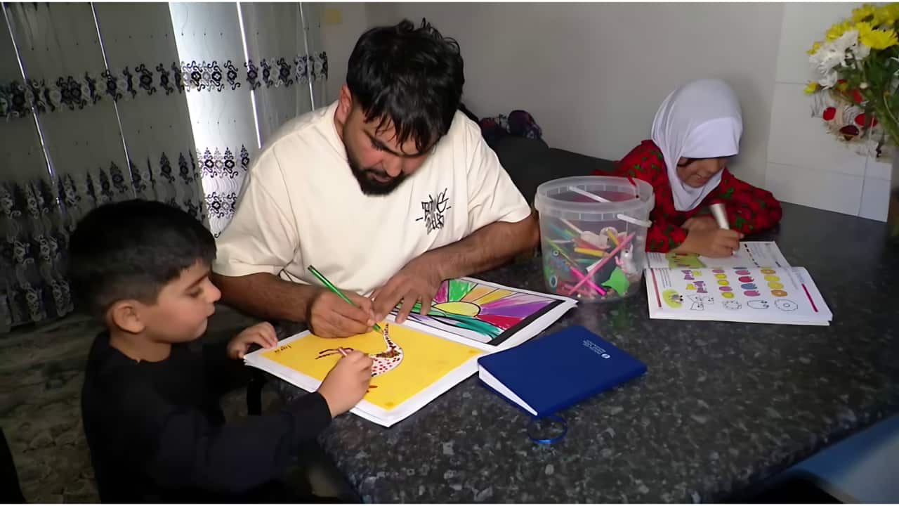 Taj Wali Raihan now lives with his family in Newcastle, NSW (SBS).png