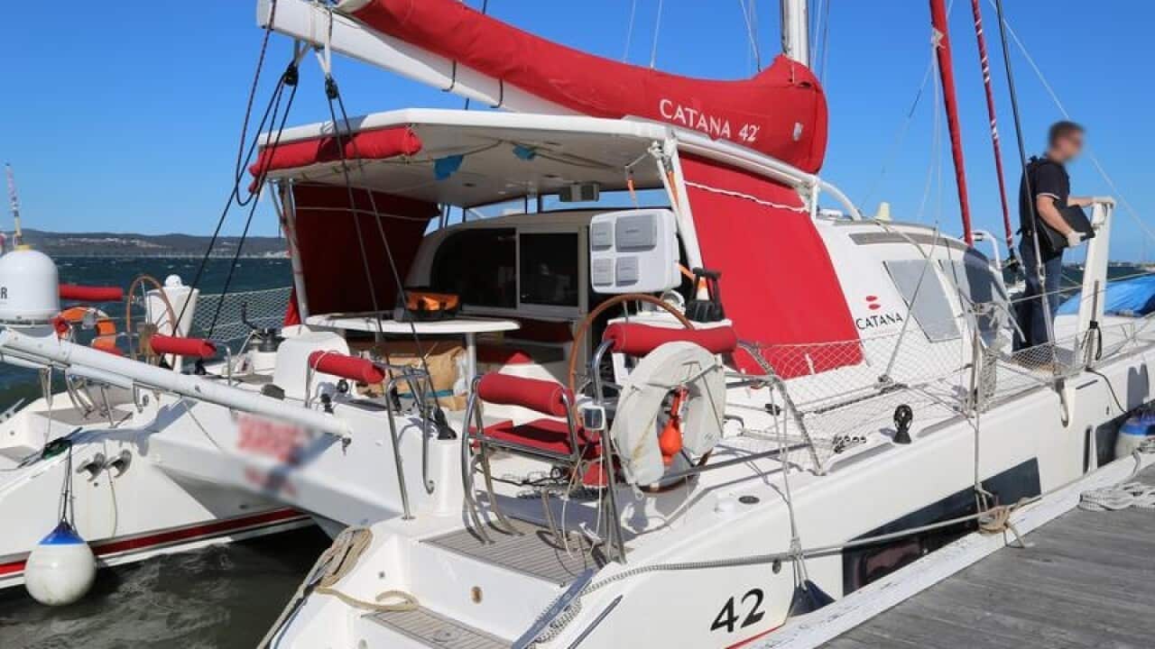 The yacht that was concealing drugs being inspected by authorities.
