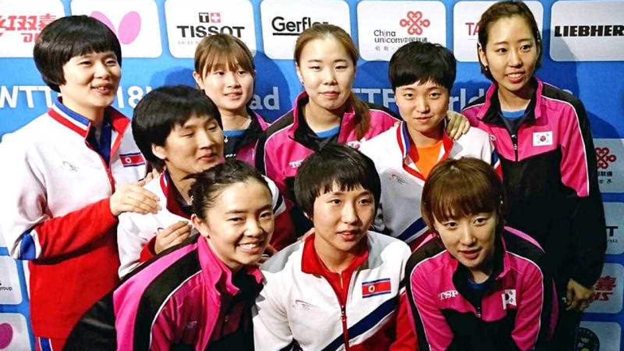 Members of North Korea and South Korea table tennis teams pose for a photograph after deciding to combine their teams to avoid playing against each other in the Quarter Finals.