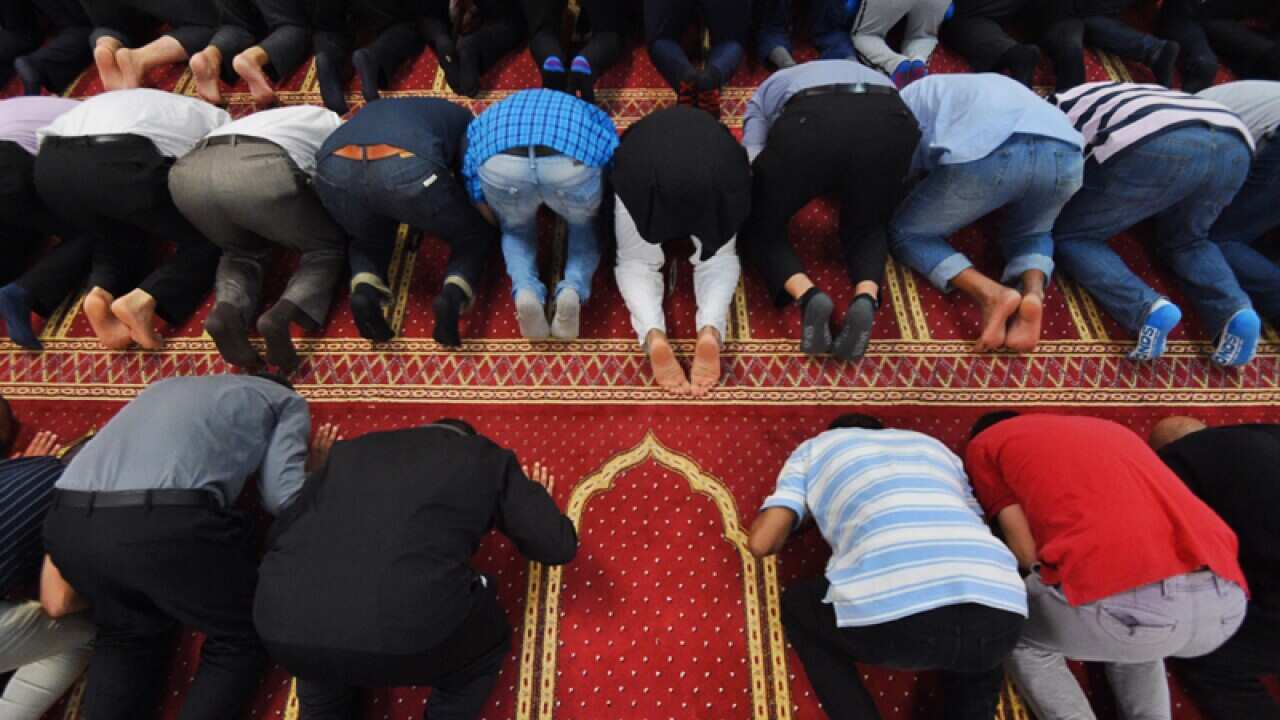Muslim worshippers pray at a mosque