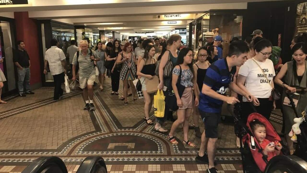 Last-minute shoppers on Christmas Eve in Sydney's Pitt St.