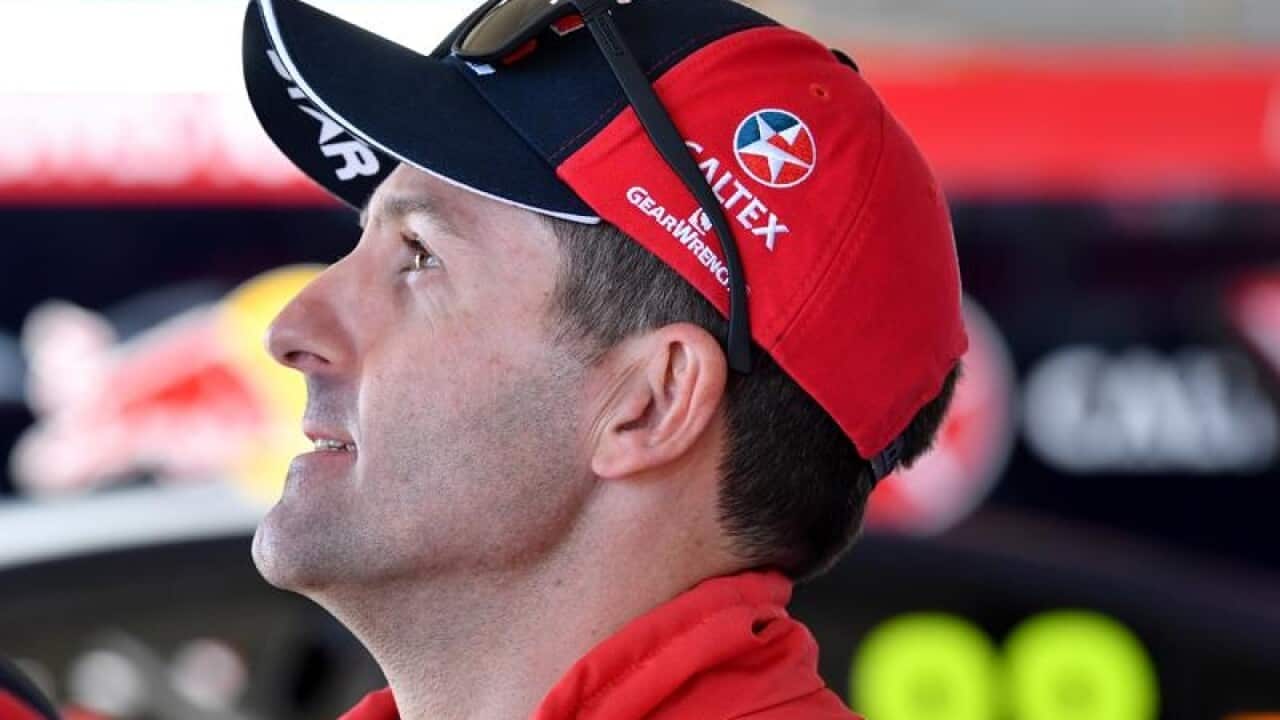 Jamie Whincup of the Red Bull Holden Racing team in the pits.