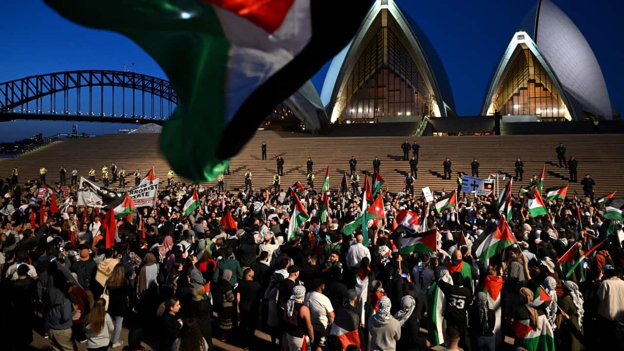 People gather for a rally near Sydney Opera House.