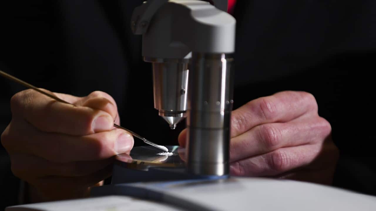 A scientist testing a pill.