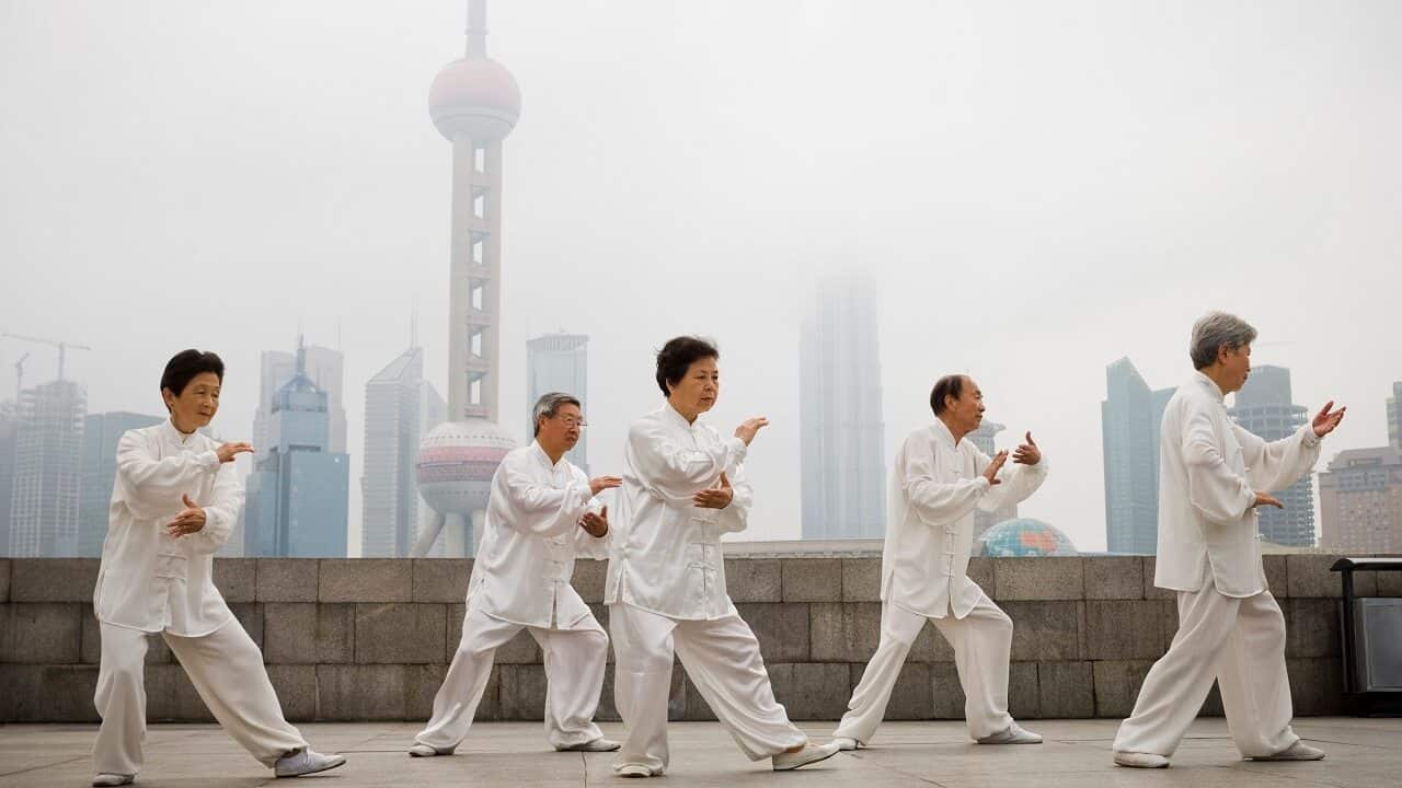 A group practicing Tai Chi in China.