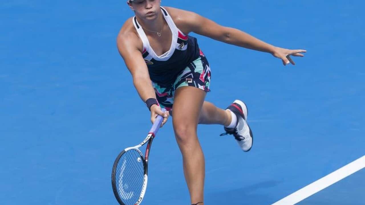 Ashleigh Barty of Australia returns a ball against Veronica Cepede.