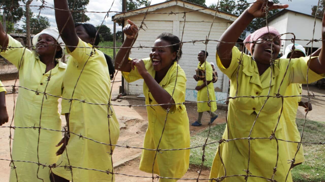 Female prisoners celebrate before their release