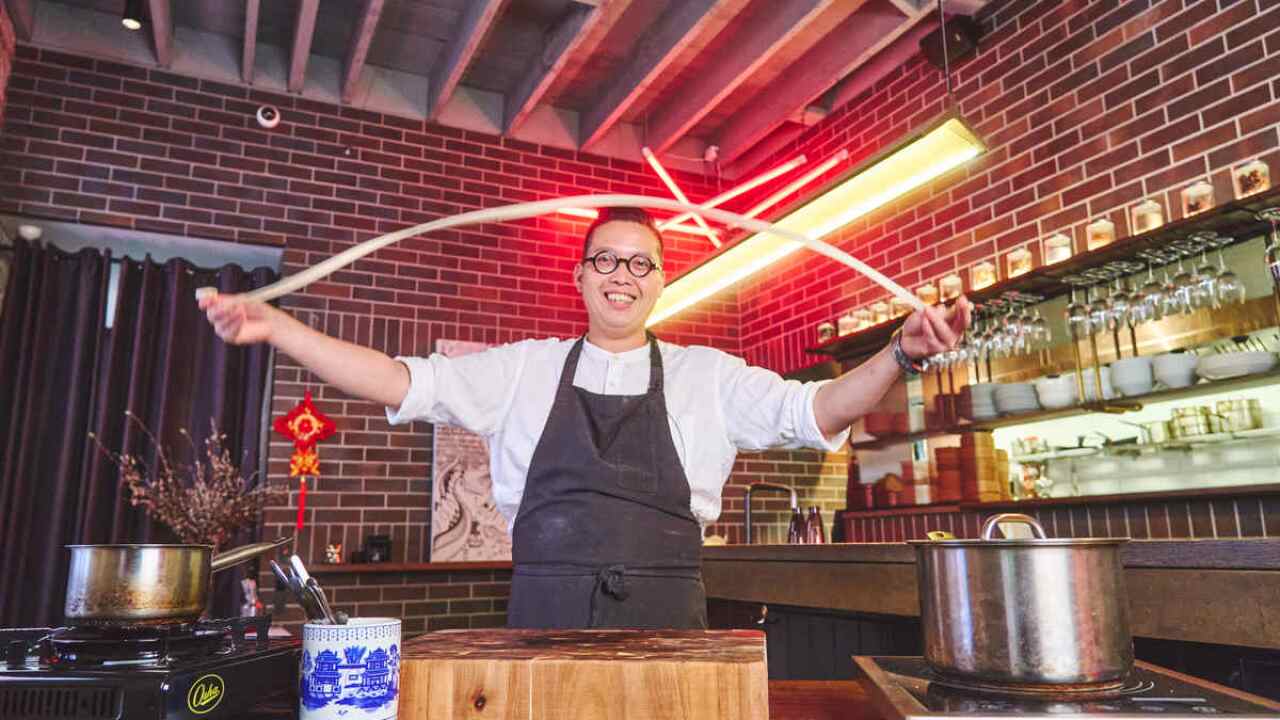 Victor Liong pulling biang biang mian noodles.