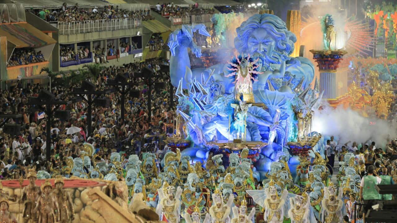 The float and dancers parade at the Sambódromo during the Rio Carnival