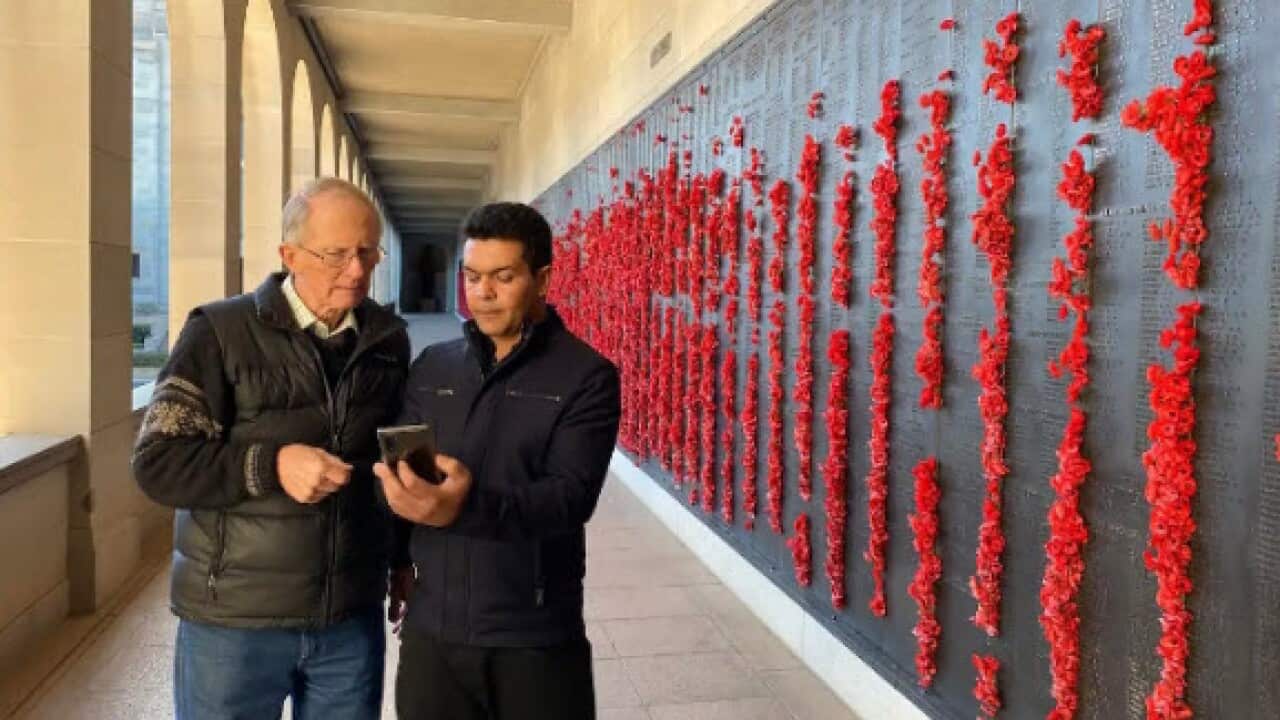 Hugh Poate meeting Farid Raman for the first time at the Australian War Memorial in Canberra (SBS).jpg