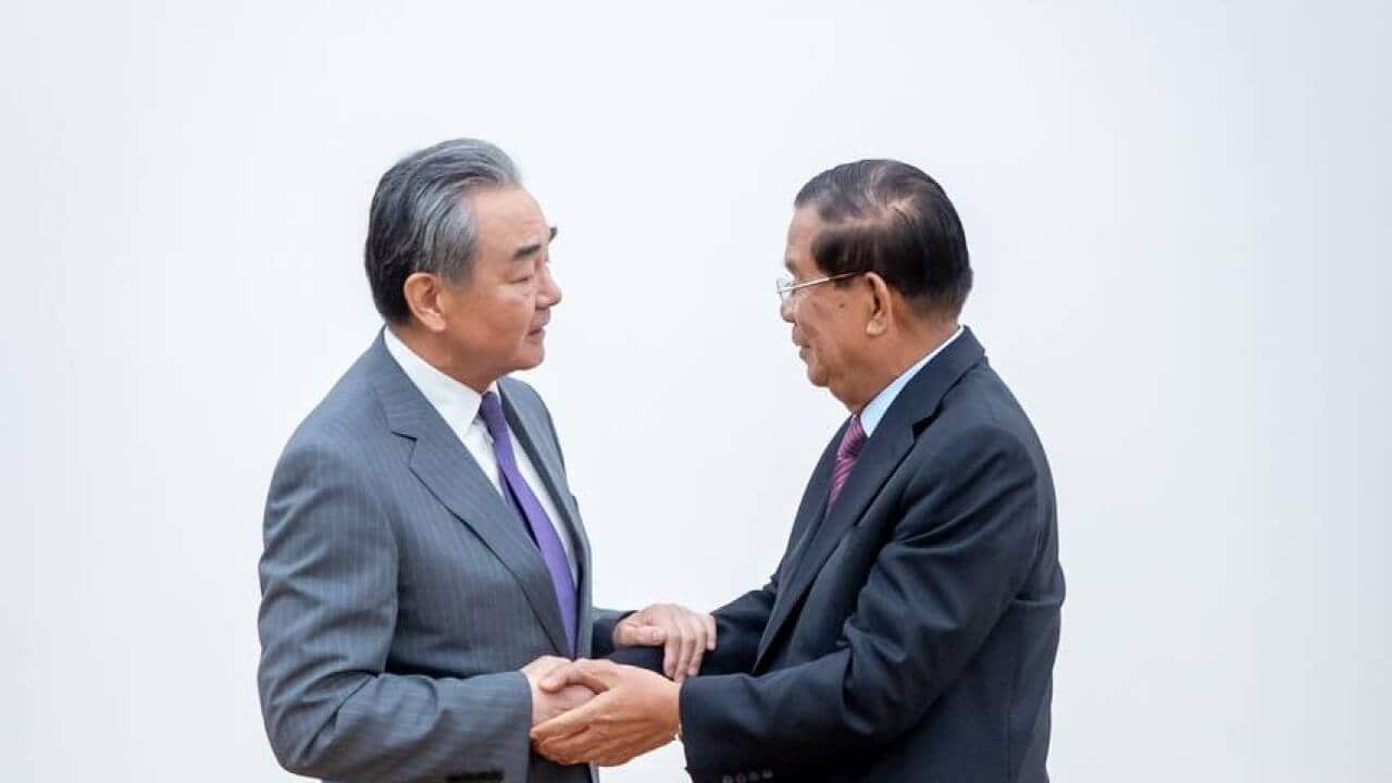 Director of Office of Feorign Affairs Commisiion Wang Yi and CPP leader Hun Sen.jpg