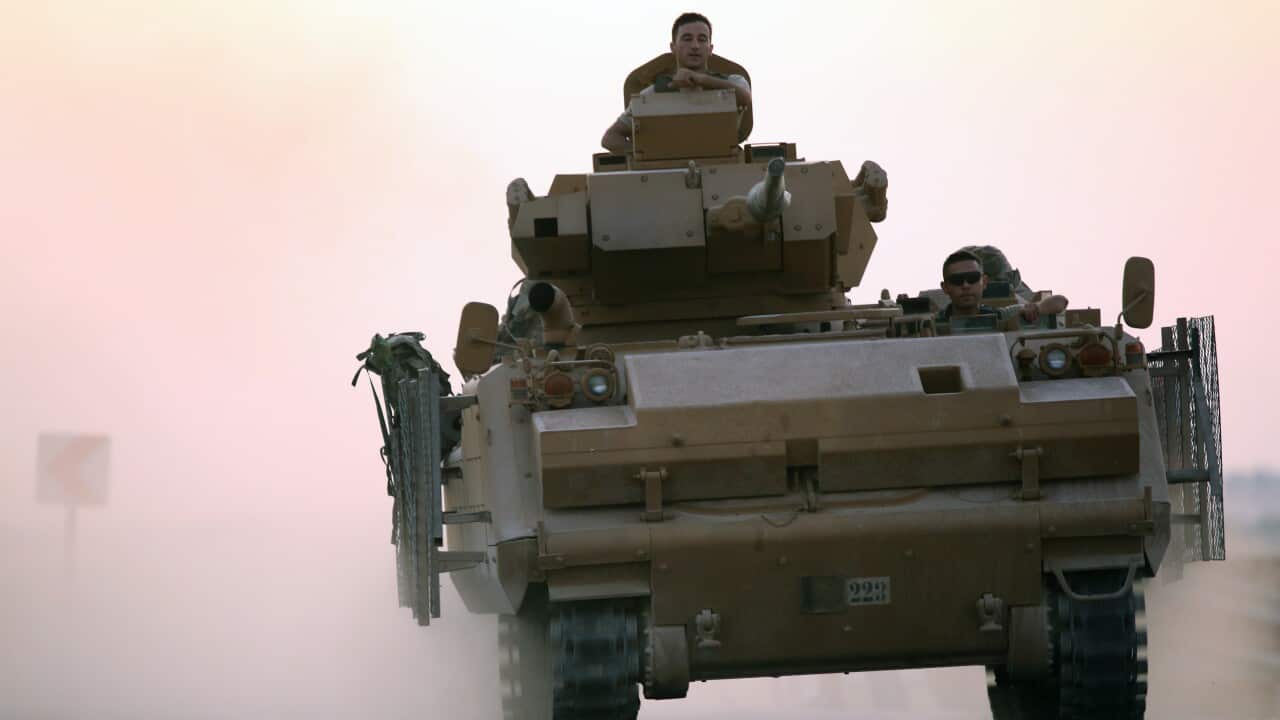Turkish armoured elements advance on Kurdish positions in northern Syria.