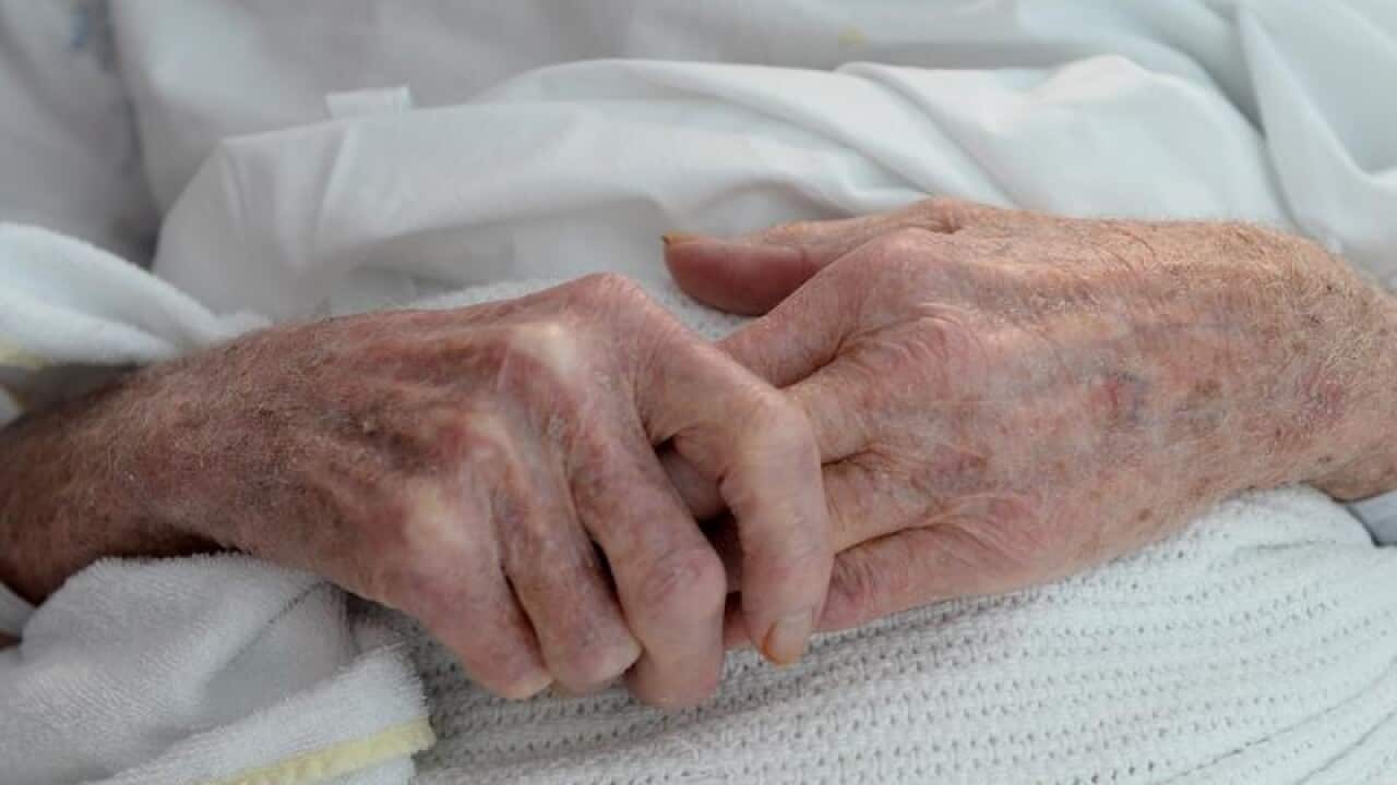 An elderly patient's hands