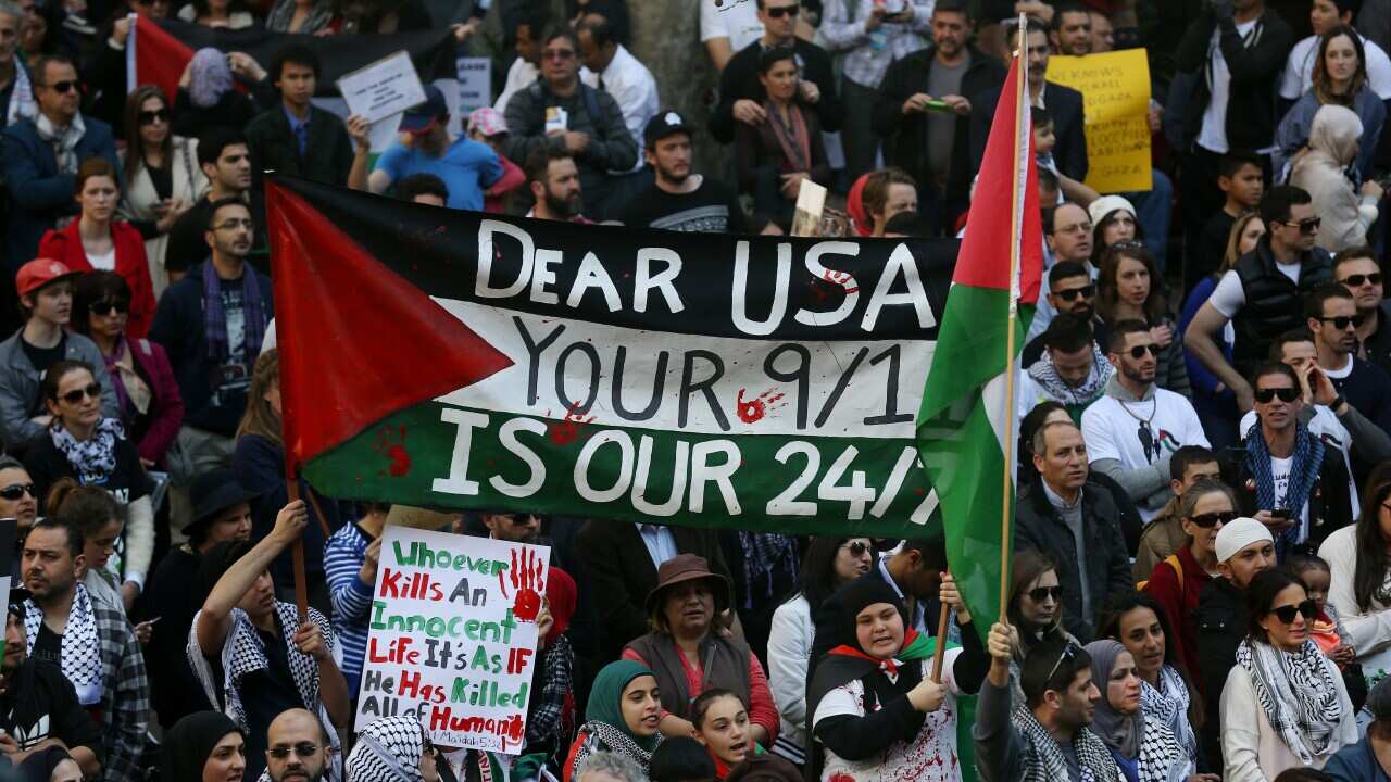 Pro-Palestinian protesters march down Sydney's George Street on Wednesday, May 15, 2013. Some 350 people gathered to protest the 65th anniversary of the creation of the state of Israel, and called on the Australian government to call for an end to the blo