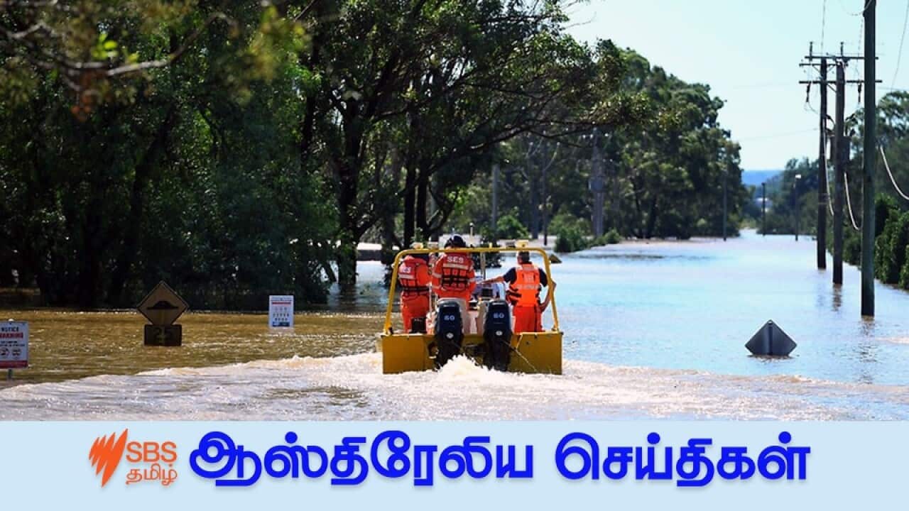 Authorities on a boat in floodwaters around Windsor in northwest Sydney