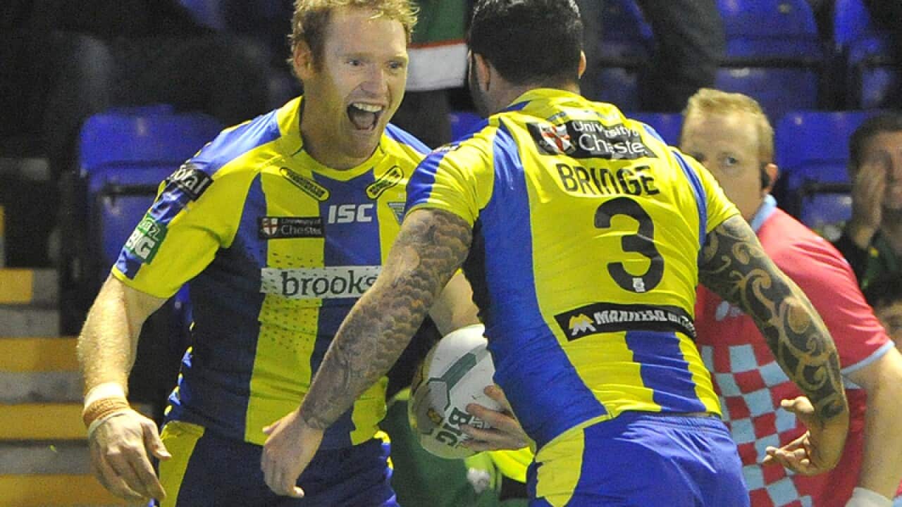 Former NRL winger Joel Monaghan (L)