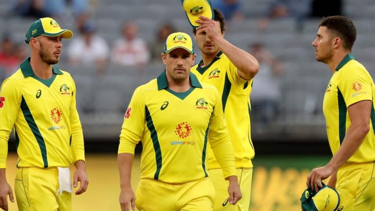 Players walk from the field after being dismissed.