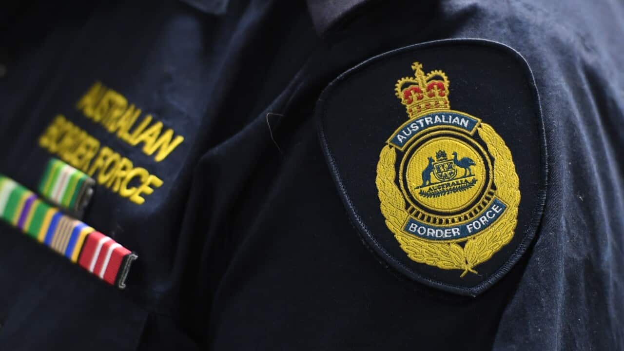 An Australian Border Force emblem is seen on a uniform