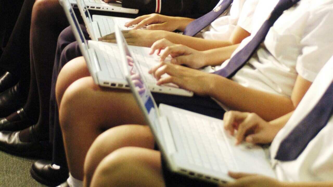 Students with laptop computers