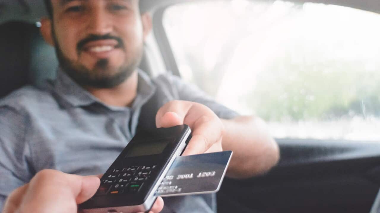 Paying in cab.jpg