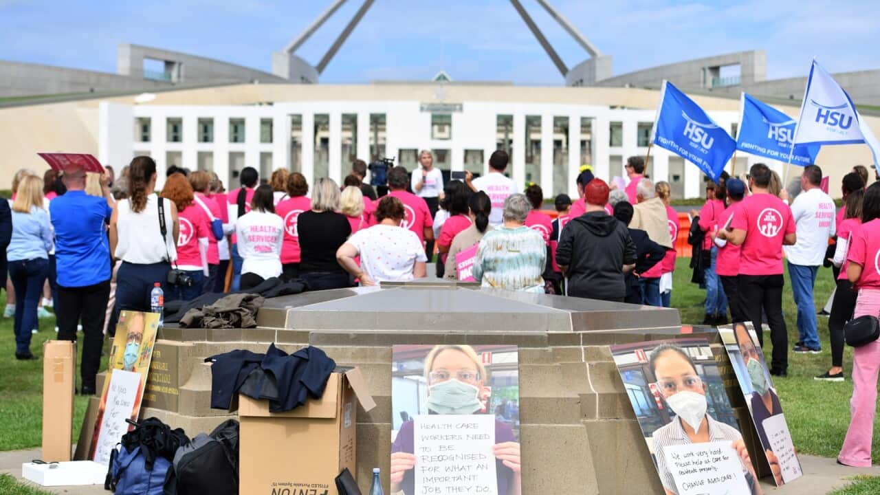 Aged care workers are seen protesting outside Parliament House in Canberra