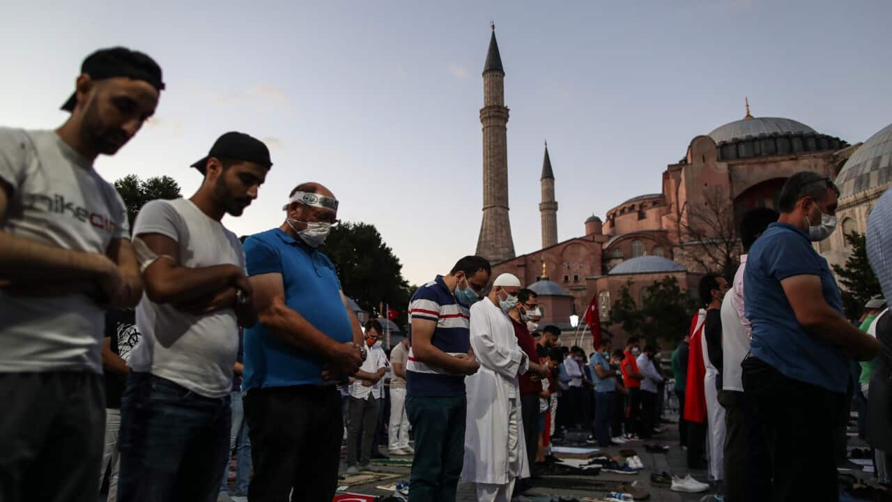 Supporters of Erdogan pray as they celebrate Turkey's decision that the 1,500 year old Unesco World Heritage site Hagia Sophia can be converted into a mosque